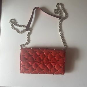 Beautiful reddish orange studding wallet on a chain